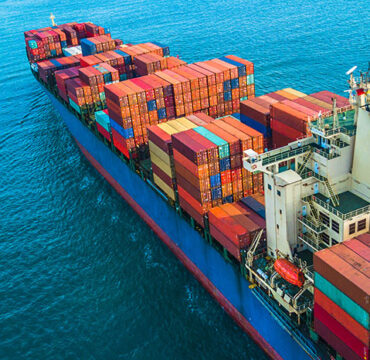Container ship entering from bottom right